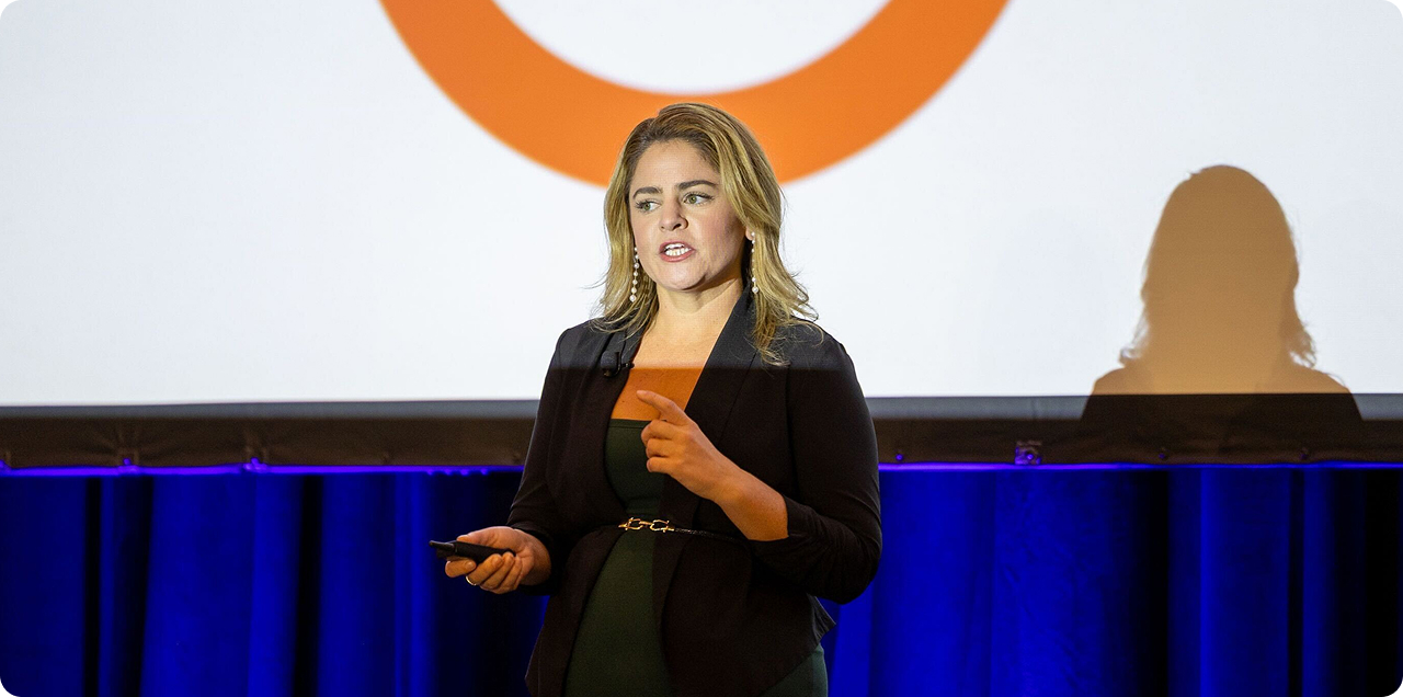 Kelsey Libert speaking at a conference
