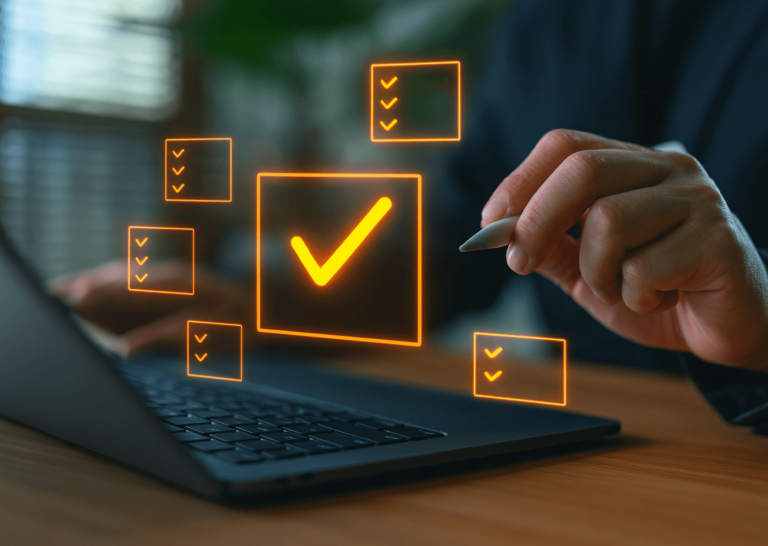 Hand using a stylus to check off a digital PR agency evaluation checklist on a laptop, representing KPI tracking and scorecards